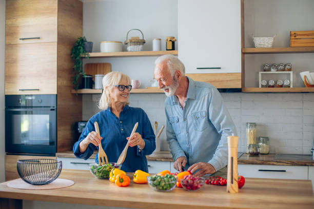 istock Senior couple preparing food in the kitchen 2186923540