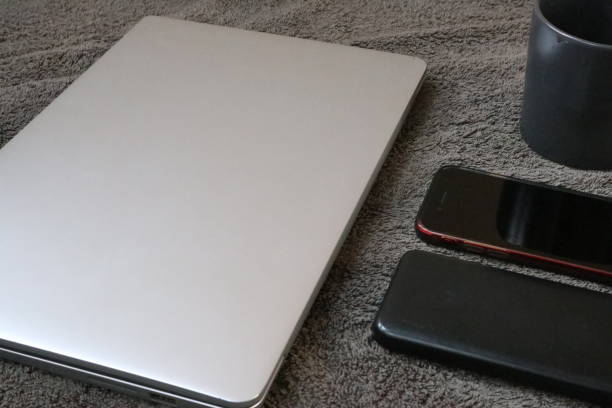 Closeup shot of laptop with digitaltablet and smartphone on desk. Modern devices on desk at office. Three different type of screen to put your responsive web page on.