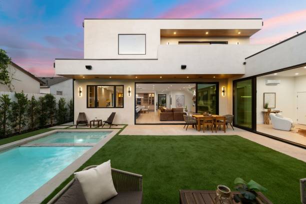 istock Modern luxury home exterior with pool and patio at sunset. 2186926452