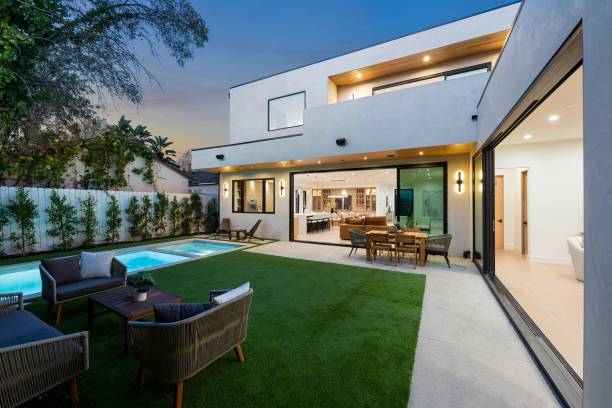 istock Modern luxury home with open living area and pool at dusk. 2186926460
