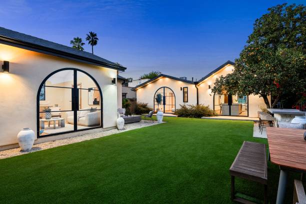 istock Courtyard with green grass and white buildings 2186926485