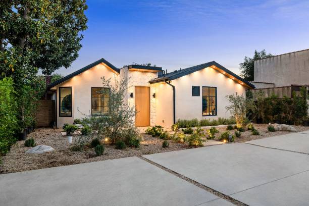 istock Modern single-story house with landscaped front yard. 2186926496