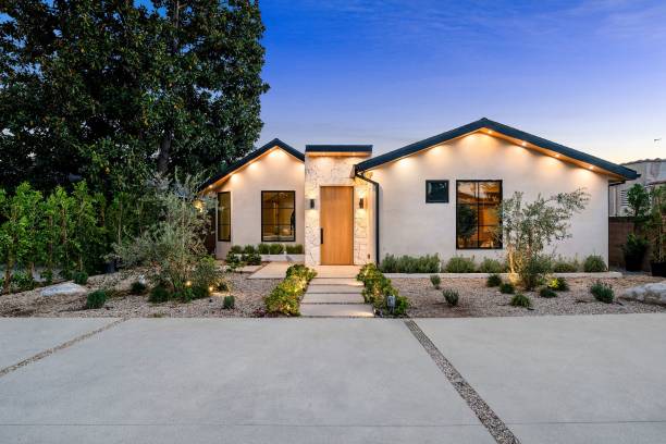 istock Modern single-story house with landscaped yard at dusk. 2186926540