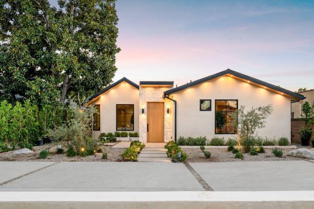 istock Modern house with minimalist garden at sunset. 2186926547