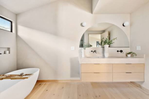 istock Modern minimalist bathroom with light wood vanity. 2186926556