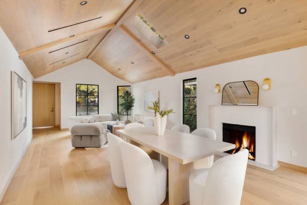 istock Modern living room with vaulted ceiling and fireplace. 2186926573