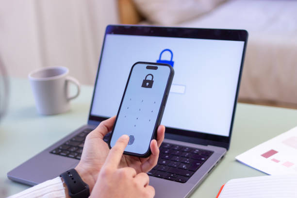 istock Woman accessing mobile banking with fingerprint scanner for secure transaction 2186927430