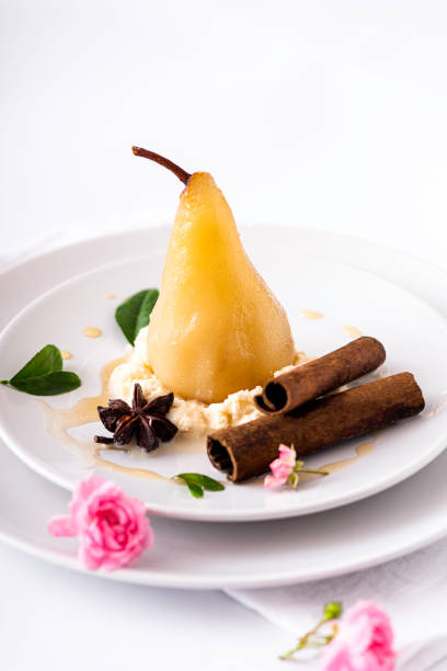 Stylish presentation plate of pear dessert on black background