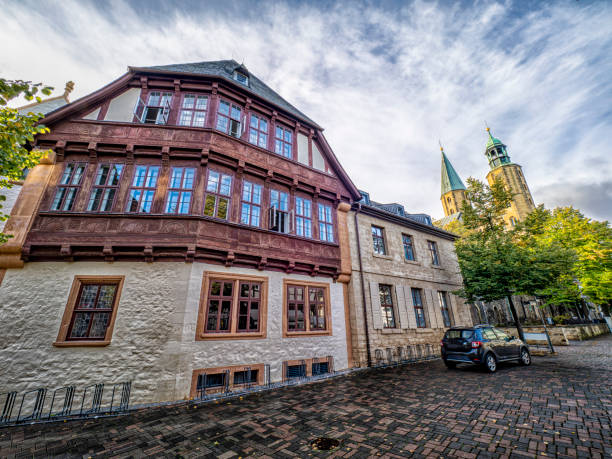Charming buildings line a cobblestone street in Goslar, Germany.