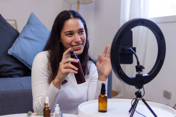 istock Young woman creating online content about beauty products 2186927969