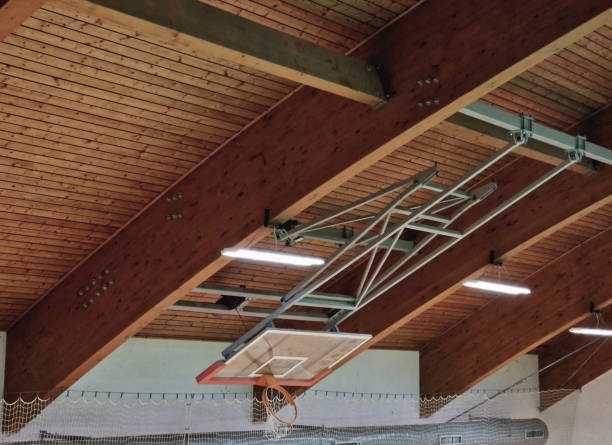 istock Sports hall with basketball hoop, foldable on the ceiling 2186929185
