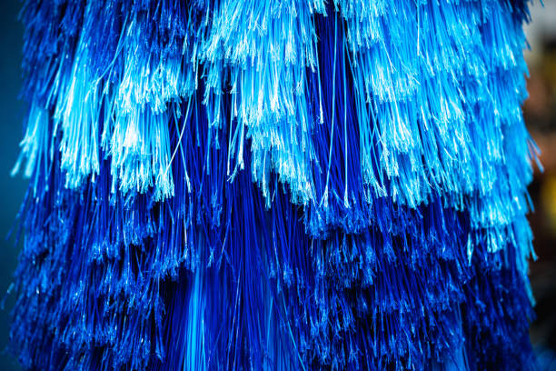 Close up shot of a clean blue brush washer at an automatic carwash station.
