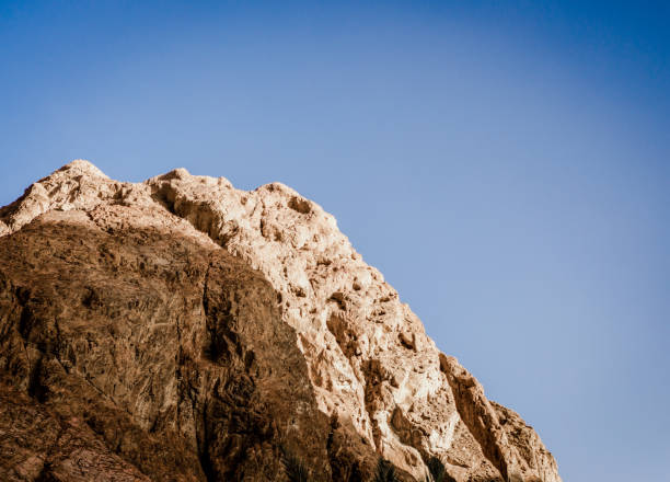 istock high rocky mountain against a clear blue sky 2186946576