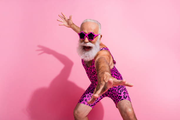 Photo of positive old man good mood dancing wear glamour leopard print overall isolated pink color background Photo of positive old man good mood dancing wear glamour leopard print overall isolated pink color background. gay man men sunglasses party stock pictures, royalty-free photos & images