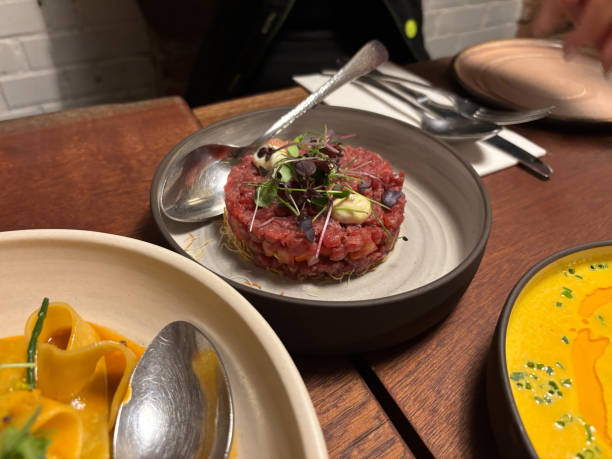 istock Beef steak tartare with soybean sprouds served at restaurant. 2186952564