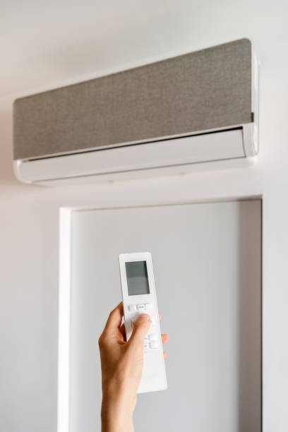 istock Modern air conditioning unit equipped with remote control for home comfort 2186953151