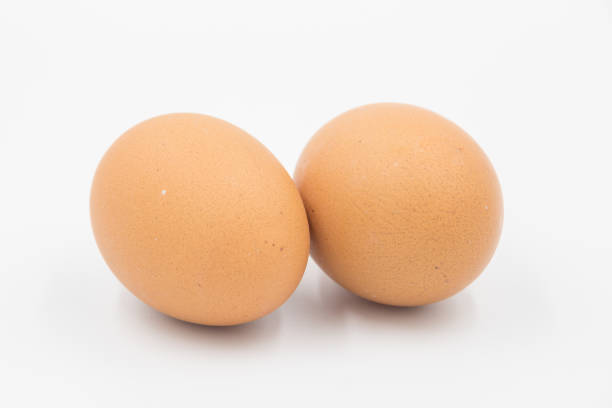 Two brown organic egg isolated on white backkground. Food and Organic concept.
