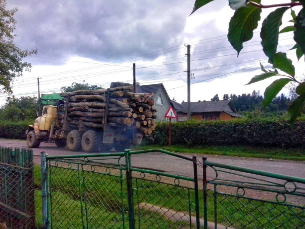 Old logging truck carrying a load of wood