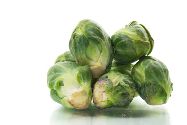 istock fresh raw brussels sprouts isolated on white background 2186956430
