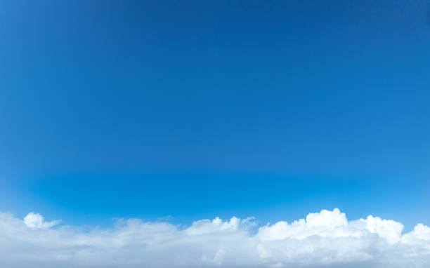 Blue sky with beautiful white cumulus clouds skyscape background backdrop
