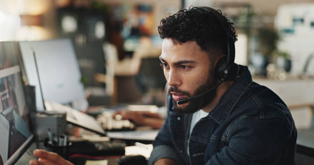 istock Businessman, tech support or headphones with computer at call center for web navigation or technical service. Male person, consultant or employee consulting for online advice, help or customer care 2186957420