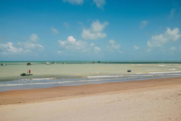 istock Scenic beach with boats on a sunny day 2186957822