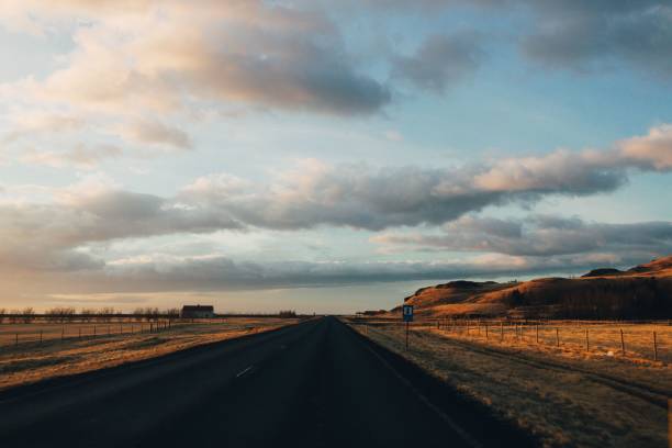 istock Long road under dramatic sky at golden hour 2186957885