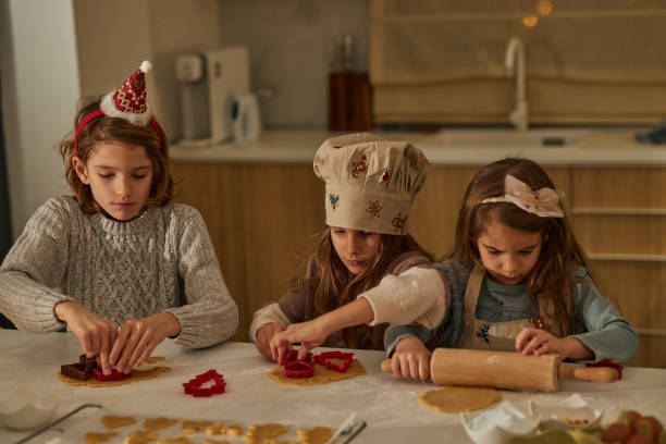 istock Beautiful children making Christmas cookies 2186959256