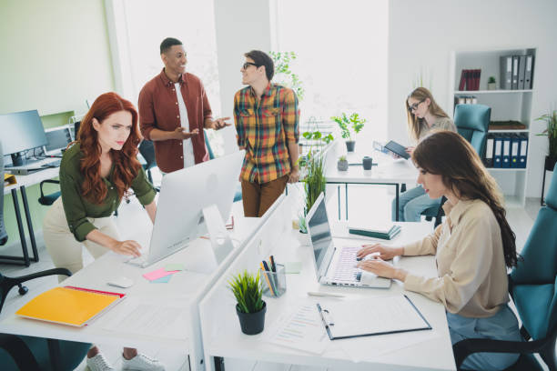 istock Portrait of five young successful colleagues communicate use computer workplace business center office indoors 2186959609