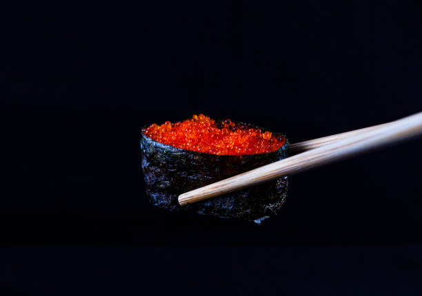 Fish Roe Gunkan by wooden chopsticks