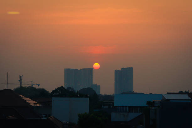 istock Urban Sunset Skyline with Silhouetted Buildings 2186965920