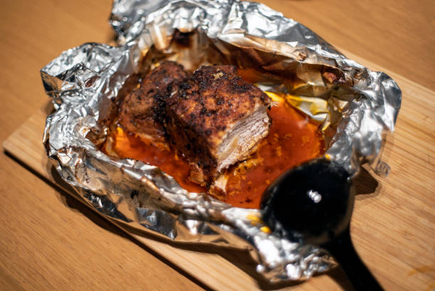 istock meat in an aluminium foil 2186966095