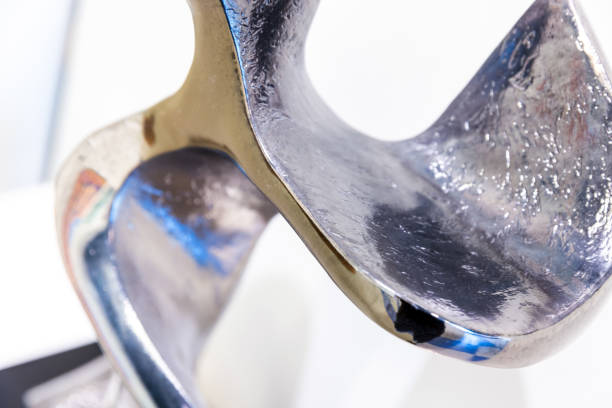 Abstract structure made of shiny metal, modern decoration design element, close-up photo with selective soft focus