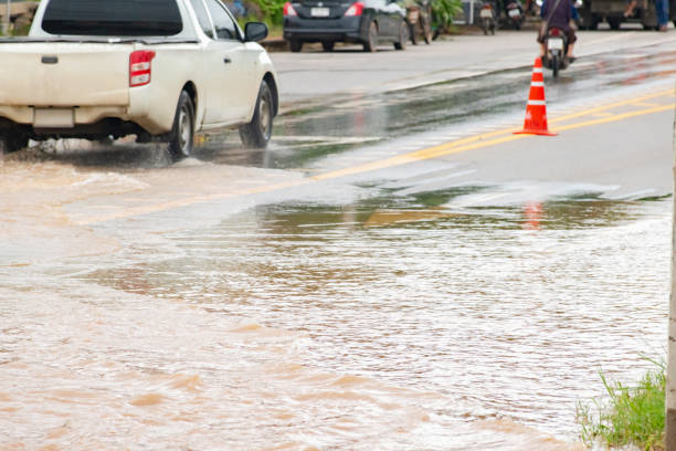 istock Muddy Rain with car in floodwater 2186970646