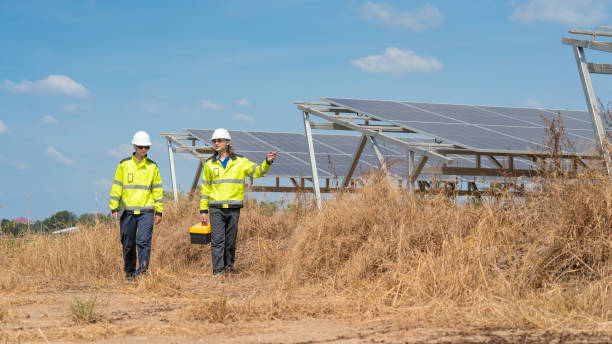 istock Caucasian electrician, technician, or engineer employed at a solar farm or sungrid plant that promotes clean, renewable energy,sustainable energy concept. 2186972775