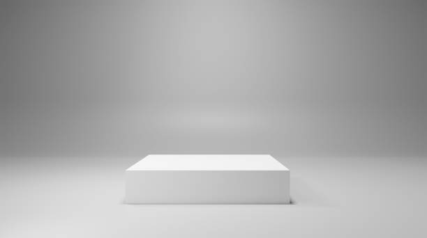 istock Minimalist white product display podium with a clean gray background for elegant presentations. 2186974023