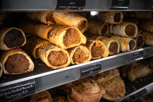 istock Artisan, handmade British sausage rolls on a warming shelf ready to be sold 2186974051