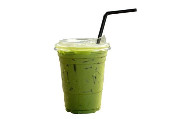Ice of milk green tea in plastic cup isolated white background.