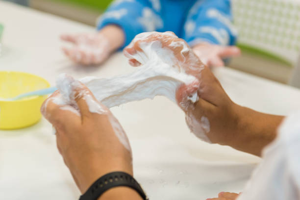 istock Pulling slimes in the hands of a child. 2186978709