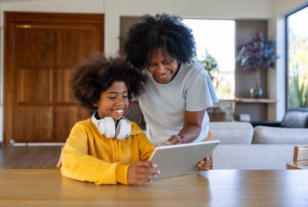 istock Grandmother assisting his grandchild while studying online using a tablet 2186978754