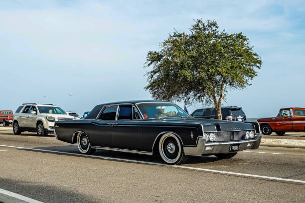 Gulfport, MS - October 04, 2023: Wide angle front corner view of a 1966 Lincoln Continental 4 Door Sedan at a local car show.