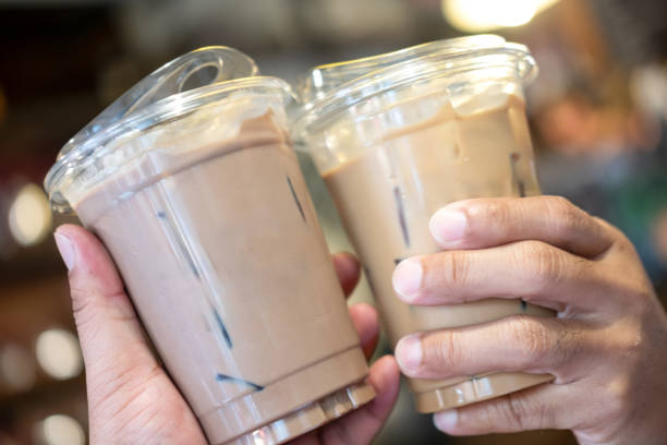 istock A couple people holding and drinking coffee together in cafe 2186986213