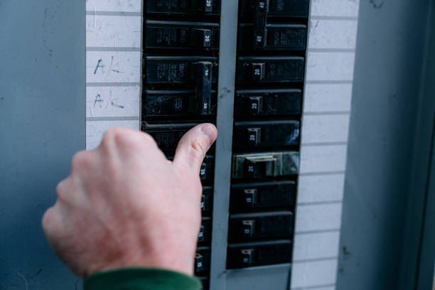 istock Man's Hand Checking and Turning on/off a Circuit Breaker at the Fuse Box Panel 2186987332