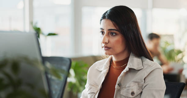 istock Reading, research and computer with business woman in office for planning, networking and company newsletter. Website designer, client feedback and online with person in creative startup for proposal 2186989247