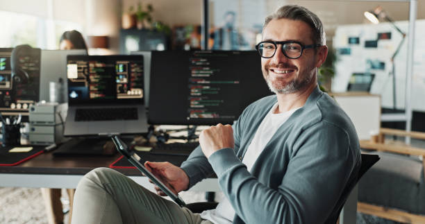 programmer, business man and portrait with tablet for software development, ai database and code online. engineer, happy face and mature manager on digital technology with glasses in creative startup - programador imagens e fotografias de stock