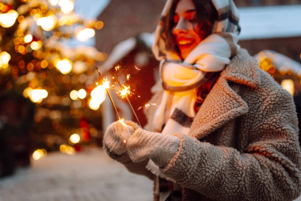 istock Burning sparklers in woman's hands. Winter holidays. 2186989969