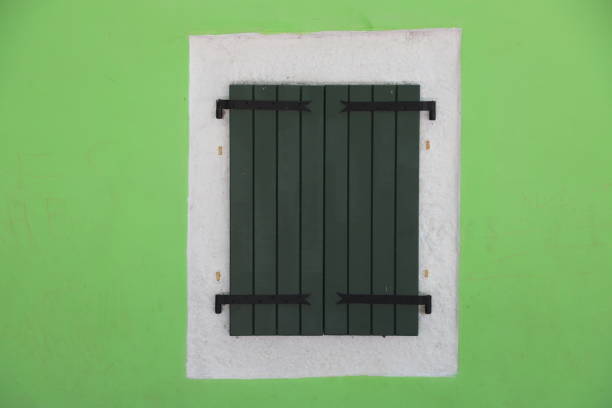 old wooden window guards. in green color tones