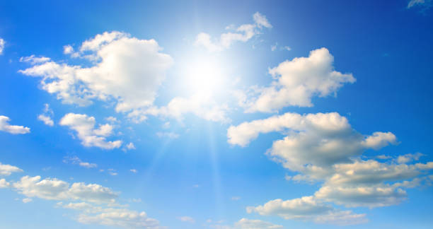 istock Blue sky with white clouds and sun. Wide photo. 2186992433