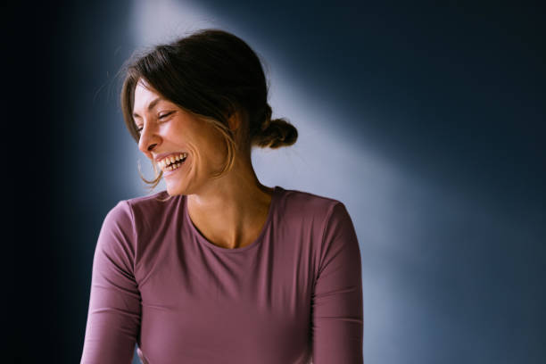istock Joyful Woman Laughing in Soft Natural Light 2186993465