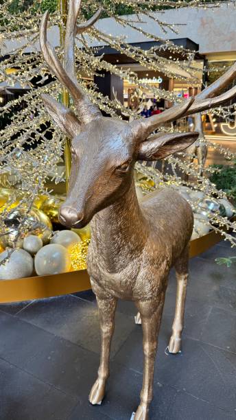 istock christmas ornaments in gold and red color 2186994399